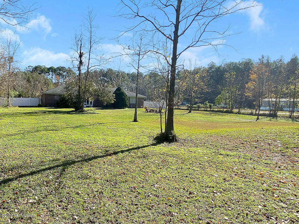 54071 Armstrong Road Callahan, FL 32011 - Photo 24 of 26 a view of a large trees with a yard