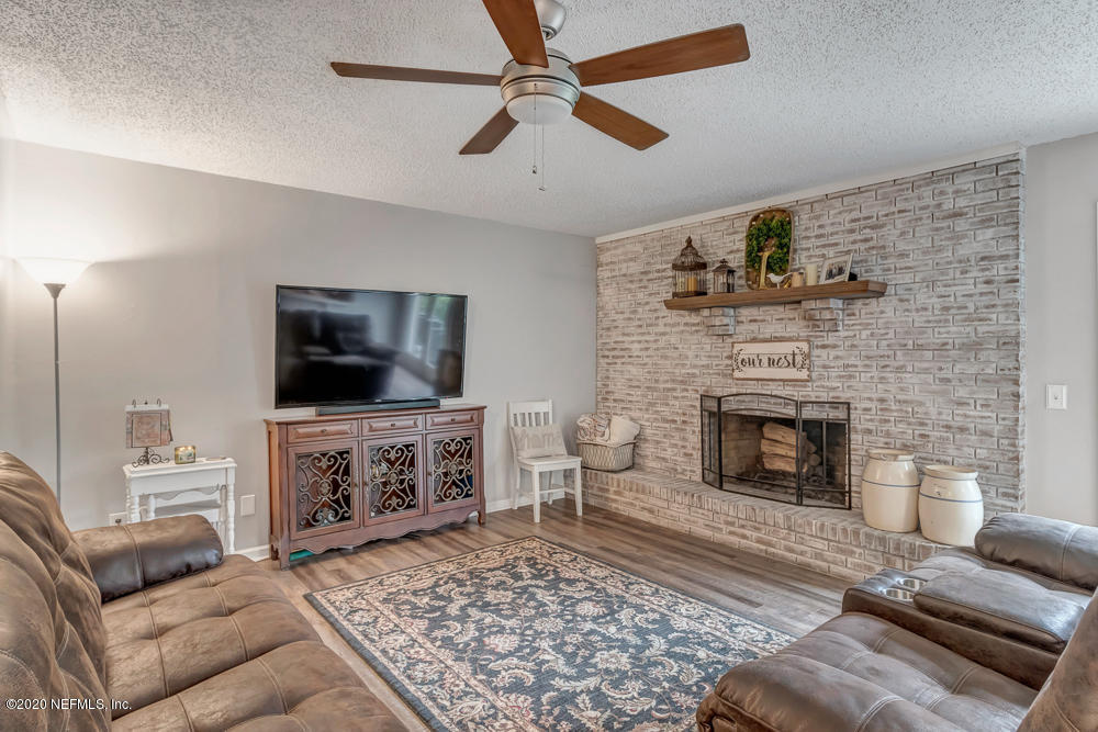 54071 Armstrong Road Callahan, FL 32011 - Photo 4 of 26 a living room with furniture and a fireplace