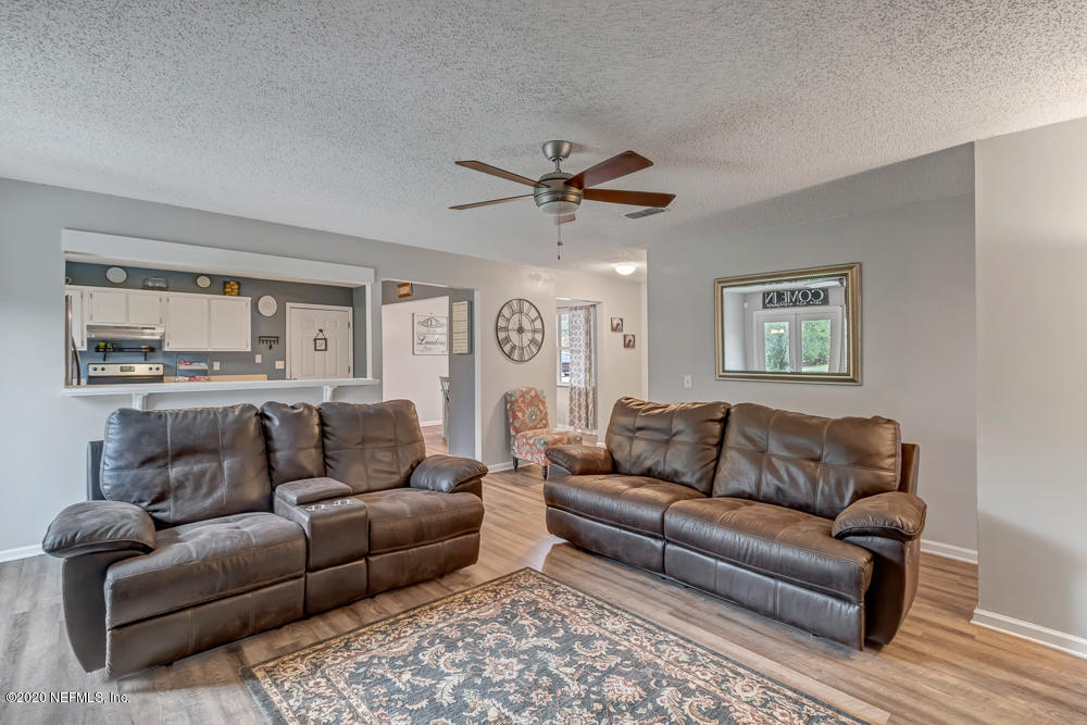54071 Armstrong Road Callahan, FL 32011 - Photo 5 of 26 a living room with furniture and a ceiling fan