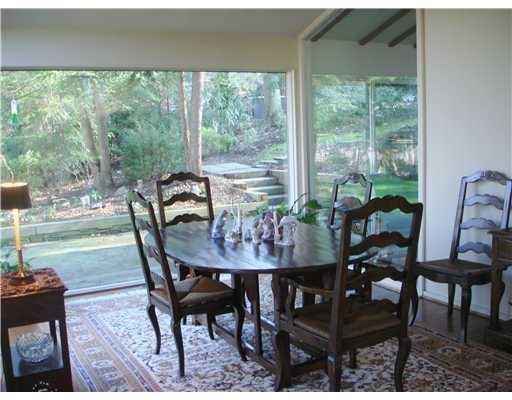 408 Buckingham Road Fox Chapel, PA 15215 - Photo 4 of 10 Dining Room. three walls of glass and view of patio and garden