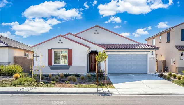 a front view of a house with garage