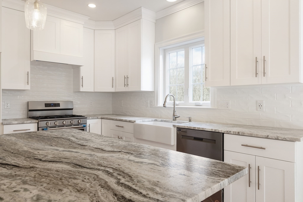 Lot 30 May Road Millis, MA 02054 - Photo 12 of 31 a kitchen with granite countertop white cabinets and white appliances