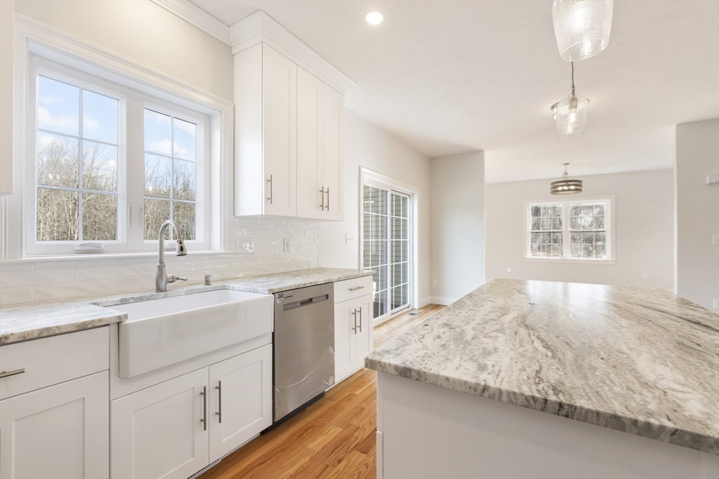 Lot 30 May Road Millis, MA 02054 - Photo 14 of 31 a kitchen with granite countertop sink and window