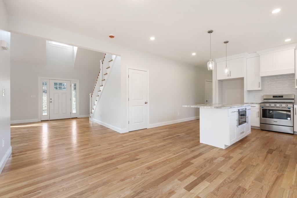 Lot 30 May Road Millis, MA 02054 - Photo 15 of 31 a view of kitchen with stainless steel appliances granite countertop a stove top oven a sink dishwasher and a refrigerator with wooden floor