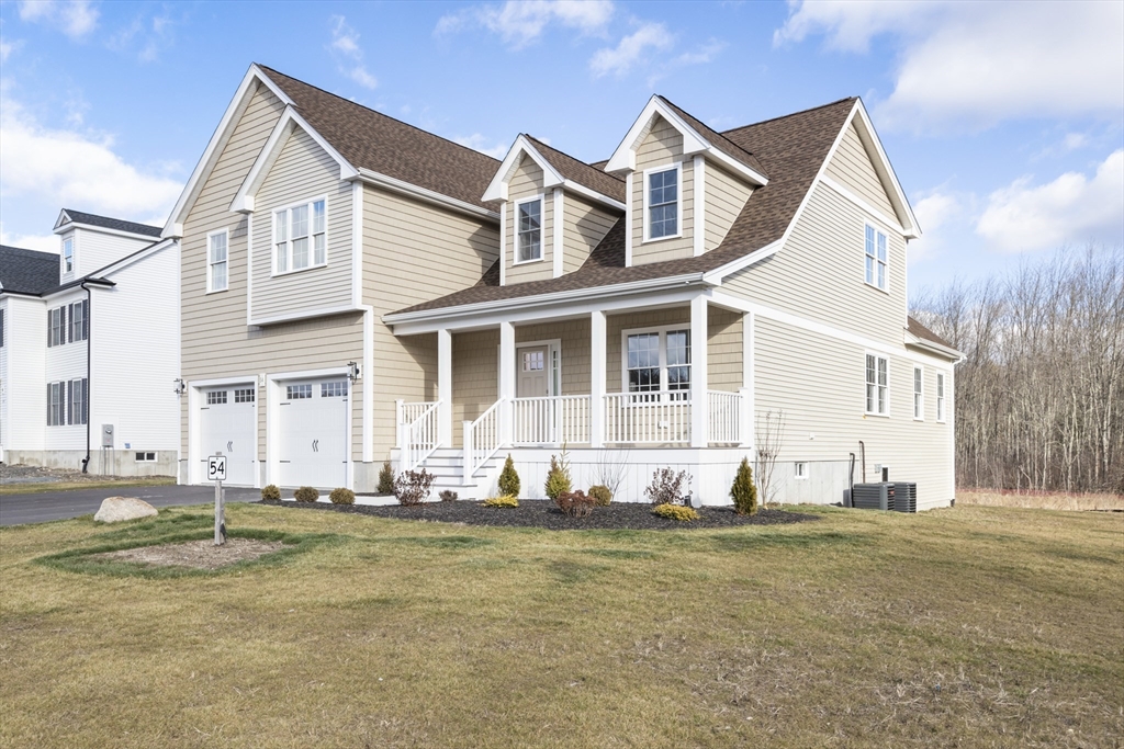 Lot 30 May Road Millis, MA 02054 - Photo 2 of 31 a front view of a house with a yard
