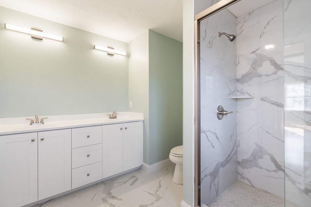 Lot 30 May Road Millis, MA 02054 - Photo 23 of 31 a bathroom with a granite countertop sink mirror and toilet