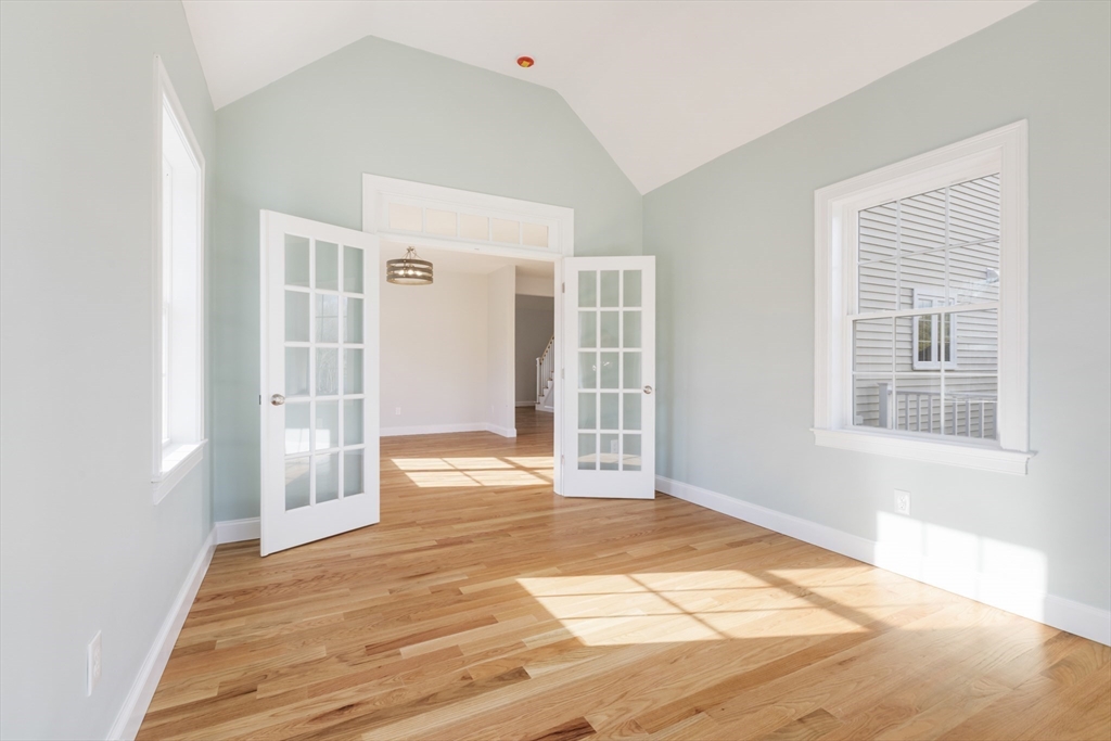 Lot 30 May Road Millis, MA 02054 - Photo 3 of 31 a view of an empty room with wooden floor and a window