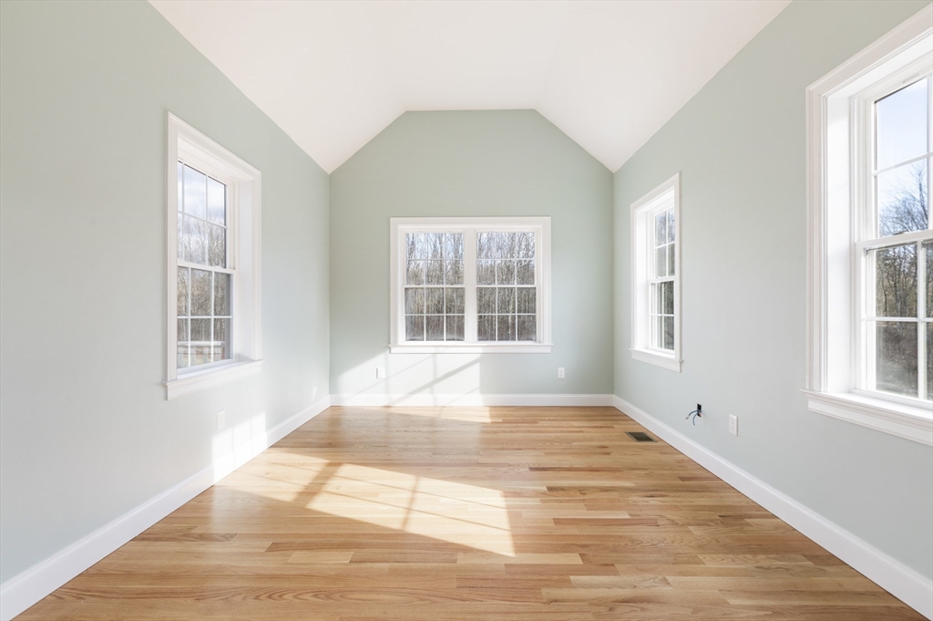 Lot 30 May Road Millis, MA 02054 - Photo 4 of 31 a view of an empty room with wooden floor and windows