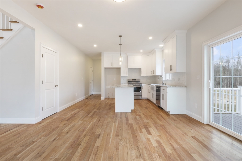 Lot 30 May Road Millis, MA 02054 - Photo 8 of 31 a view of kitchen with wooden floor and window