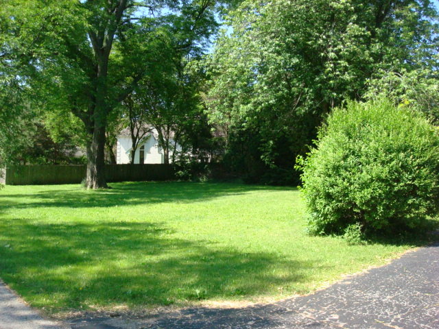1620 Miller Road Northbrook, IL 60062 - Photo 3 of 4 a view of green field with trees in the background