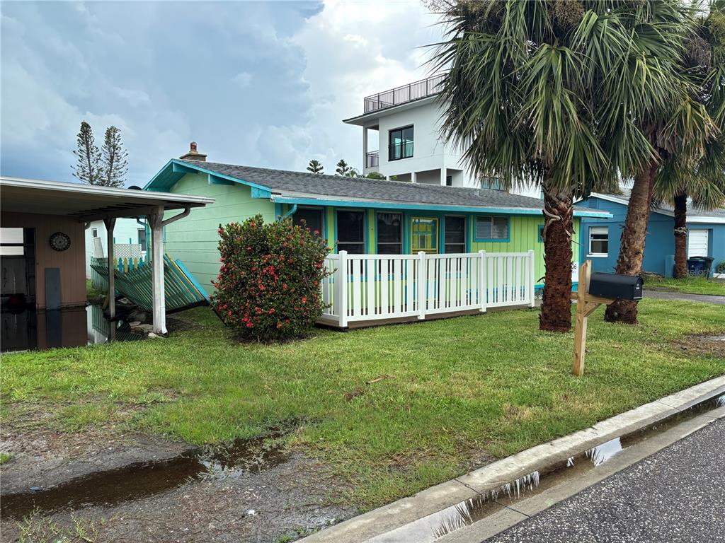 18006 4th Street East Redington Shores, FL 33708 - Photo 14 of 32 a front view of a house with garden