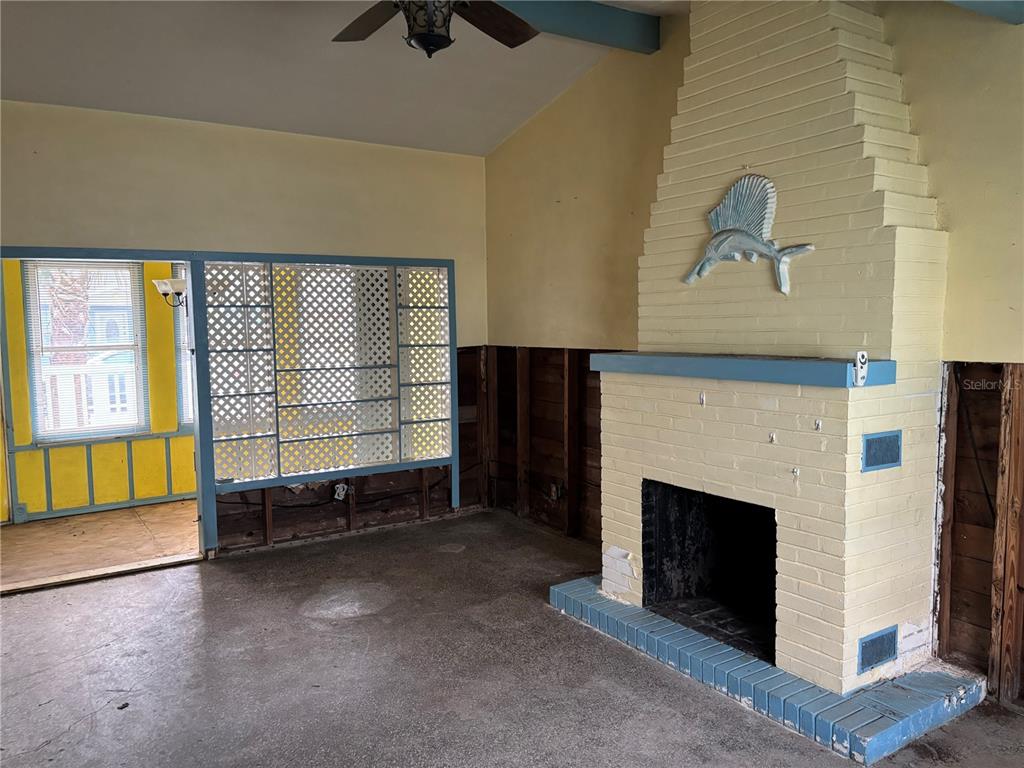 18006 4th Street East Redington Shores, FL 33708 - Photo 16 of 32 a living room with a fireplace