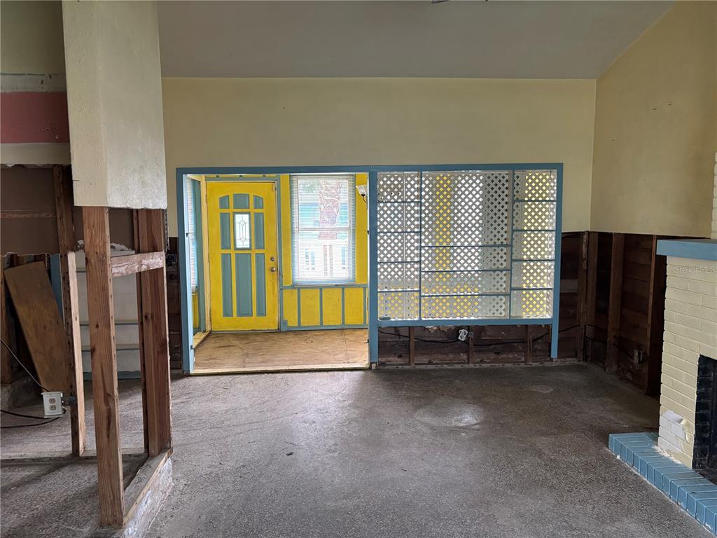18006 4th Street East Redington Shores, FL 33708 - Photo 23 of 32 a view of empty room with a fireplace