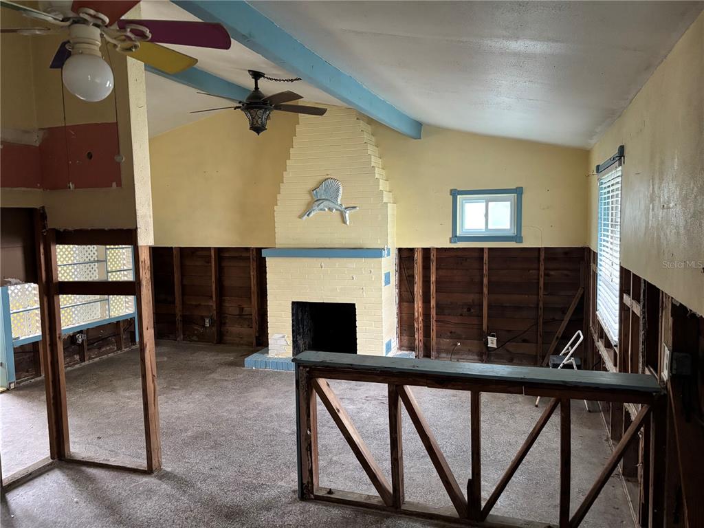 18006 4th Street East Redington Shores, FL 33708 - Photo 25 of 32 a view of a livingroom with furniture and a fireplace
