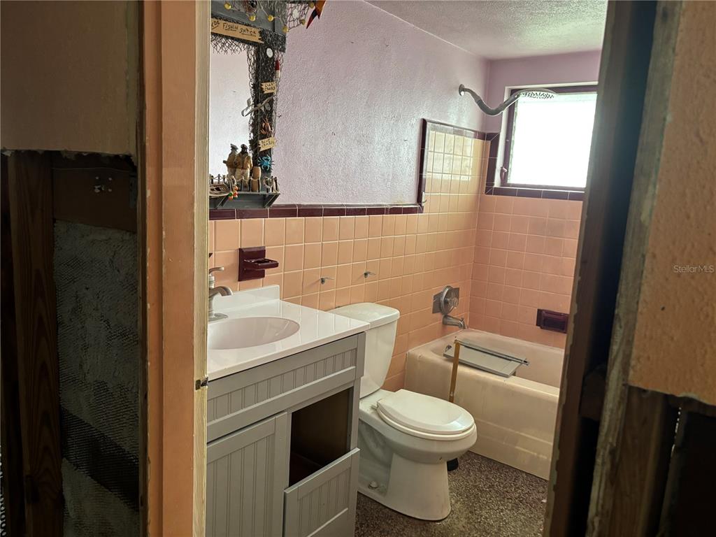 18006 4th Street East Redington Shores, FL 33708 - Photo 30 of 32 a bathroom with a sink toilet and shower