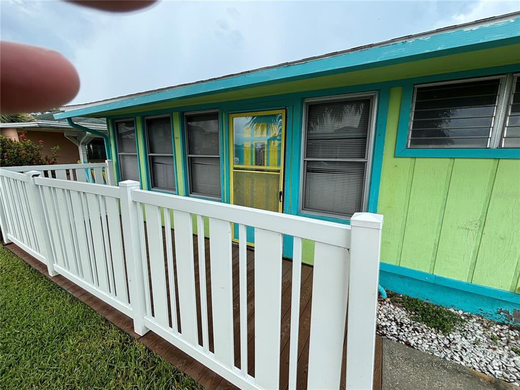 18006 4th Street East Redington Shores, FL 33708 - Photo 3 of 32 a view of a house with a window and wooden fence