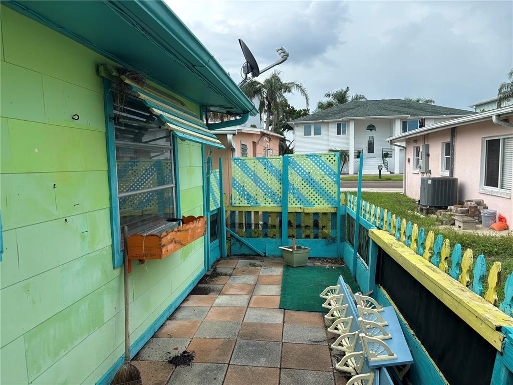 18006 4th Street East Redington Shores, FL 33708 - Photo 9 of 32 a view of a porch with furniture