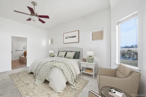 a bed room with a bed and a couch