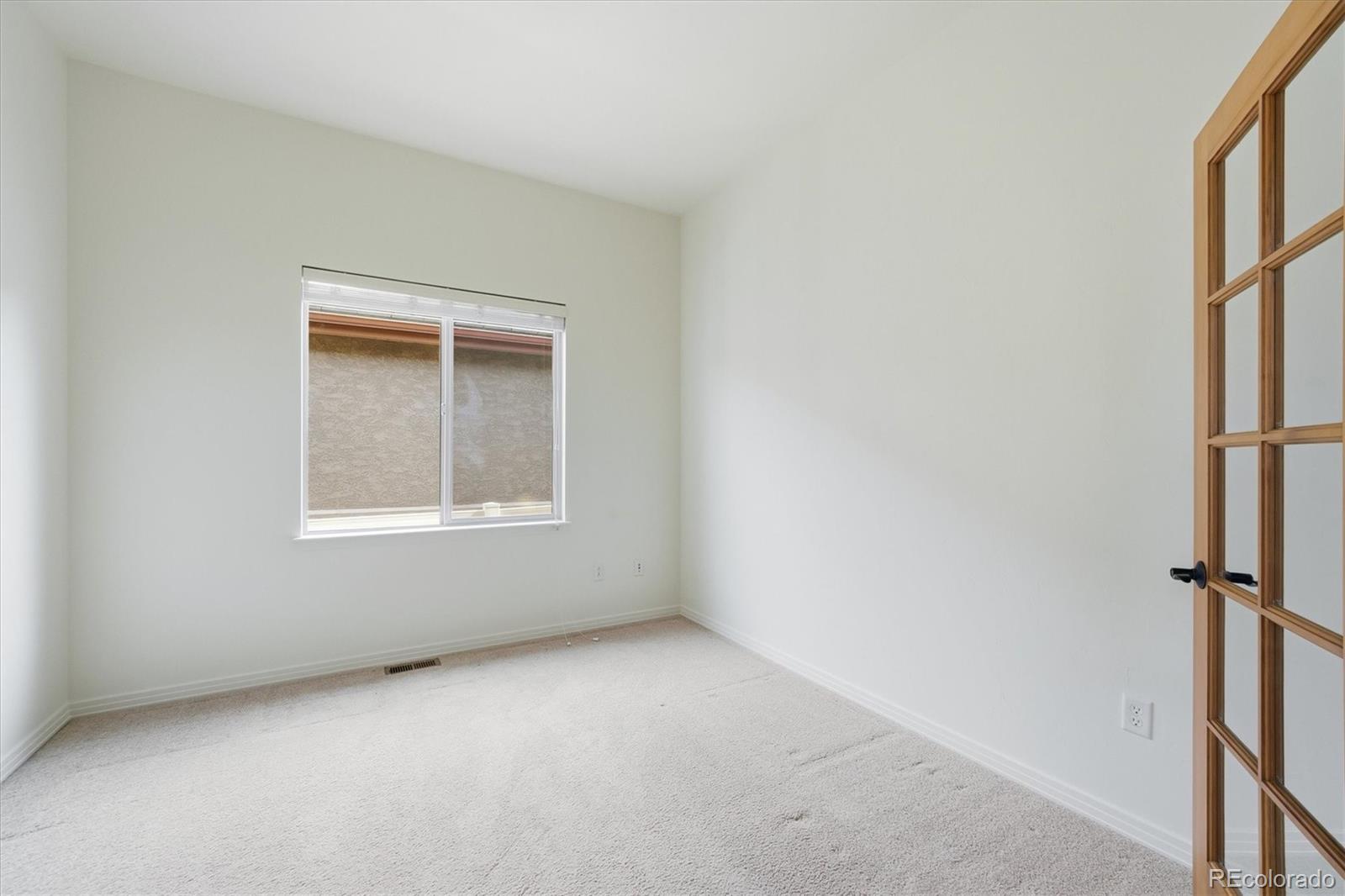 477 Rifle Way Broomfield, CO 80020 - Photo 22 of 45 an empty room with a window