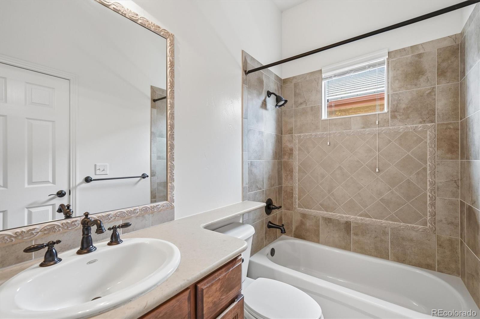477 Rifle Way Broomfield, CO 80020 - Photo 29 of 45 a bathroom with a sink and a bathtub