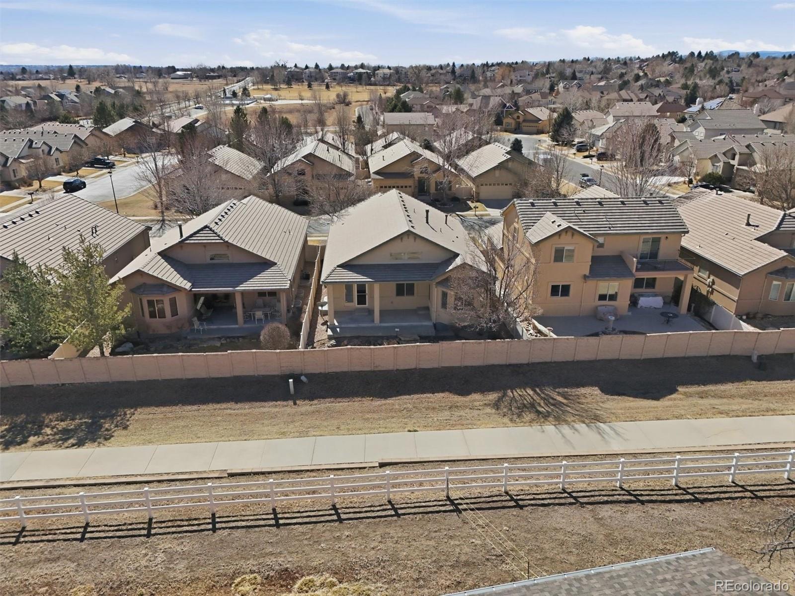 477 Rifle Way Broomfield, CO 80020 - Photo 43 of 45 an aerial view of a house with a yard