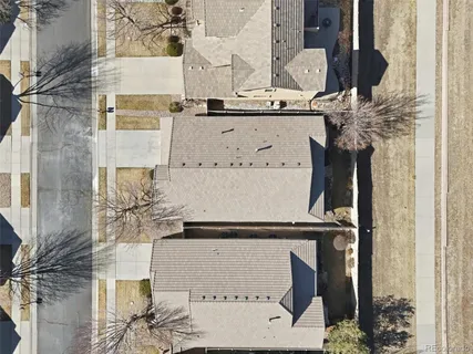 a bathroom with a black and white checkered floor