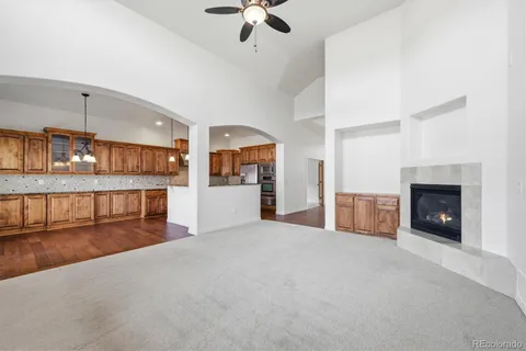 a view of a kitchen with a sink and a fireplace