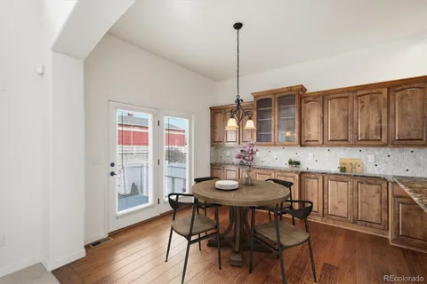 a view of a kitchen with a table and chairs