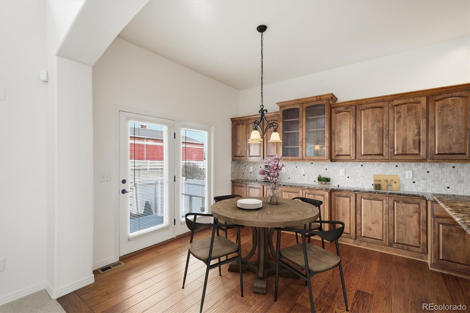 477 Rifle Way Broomfield, CO 80020 - Photo 8 of 45 a view of a kitchen with a table and chairs