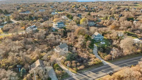 a view of a house with a tree