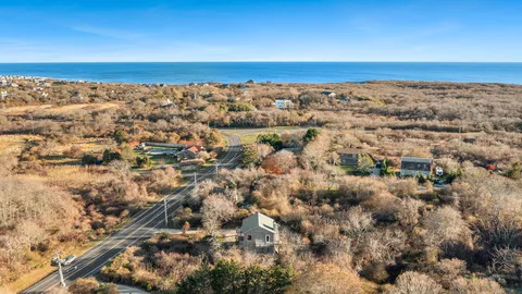 an aerial view of residential building and ocean
