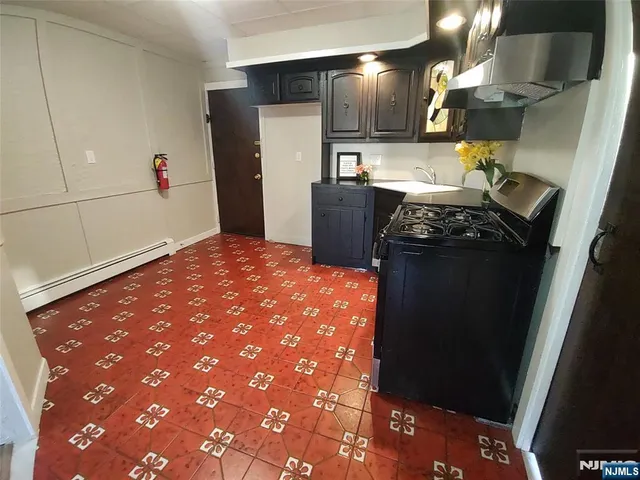 a kitchen with a sink and cabinets