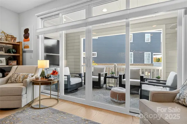 a living room with furniture and a lamp