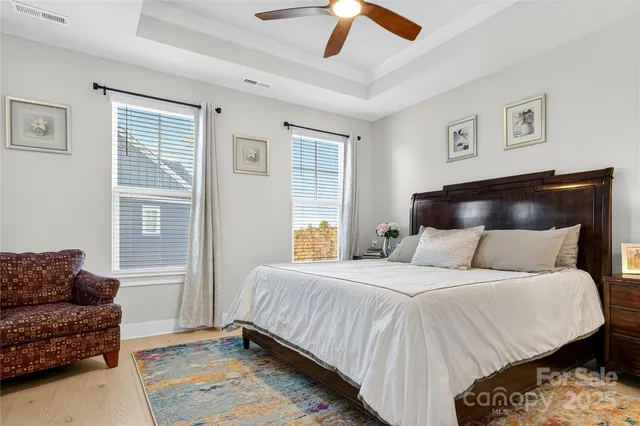 a bedroom with a bed couch and window