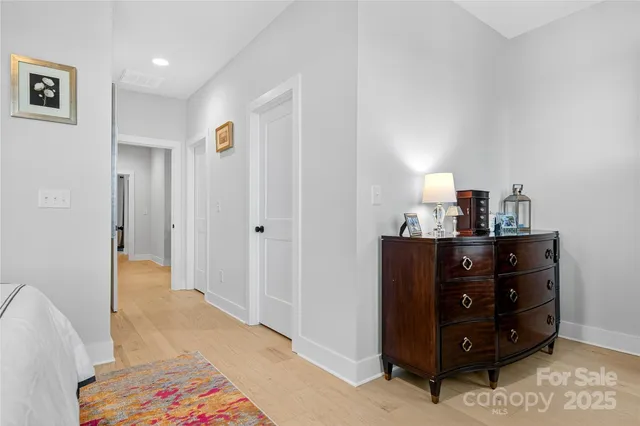 a room with a dresser and a mirror