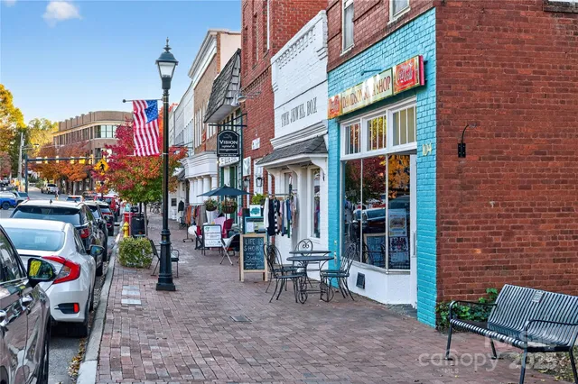 a view of buildings with sitting area