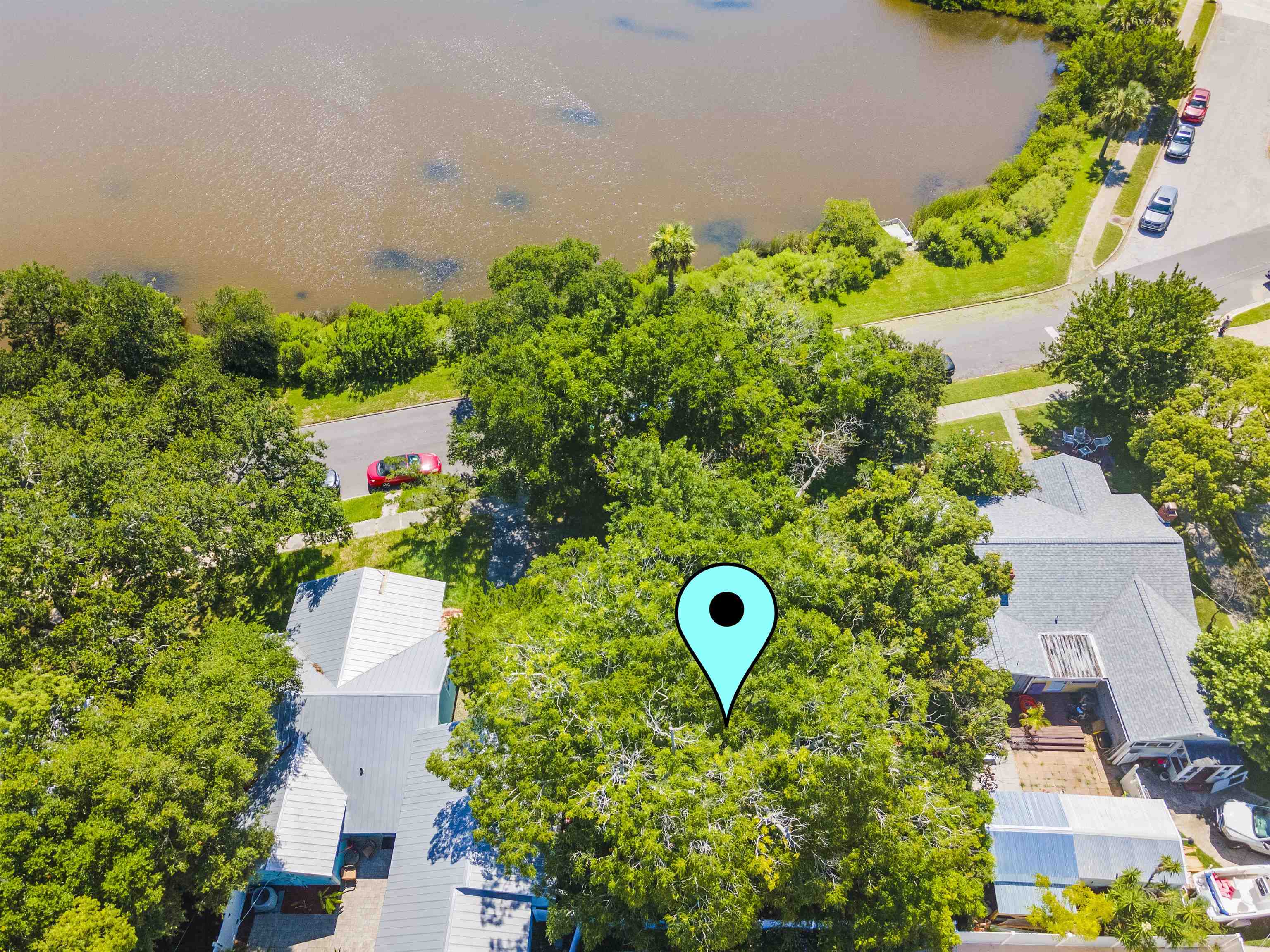 an aerial view of a house with a swimming pool yard and outdoor seating