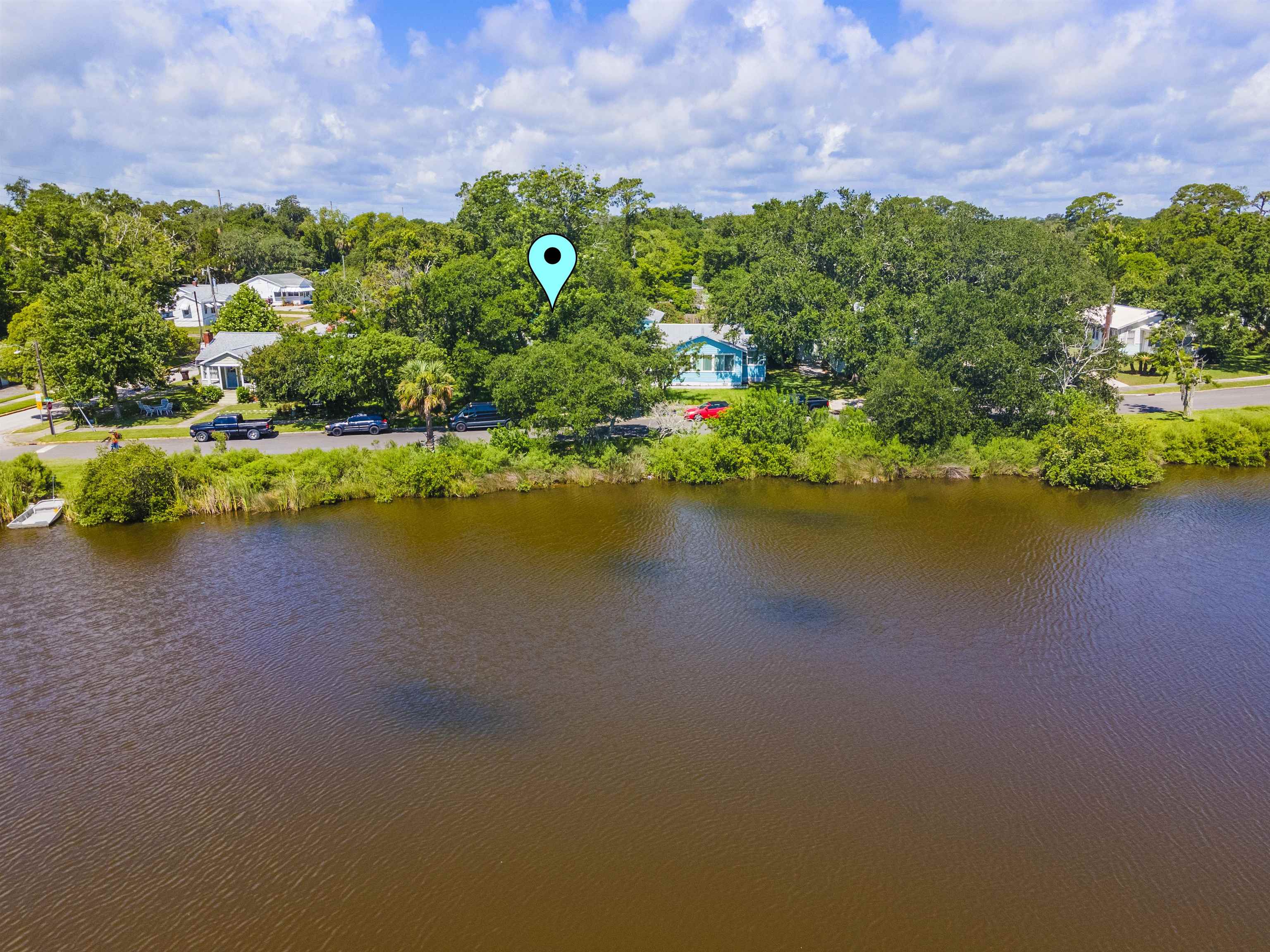 0 Rio Vista Drive St. Augustine, FL 32084 - Photo 4 of 9 a view of a lake with a building in the background