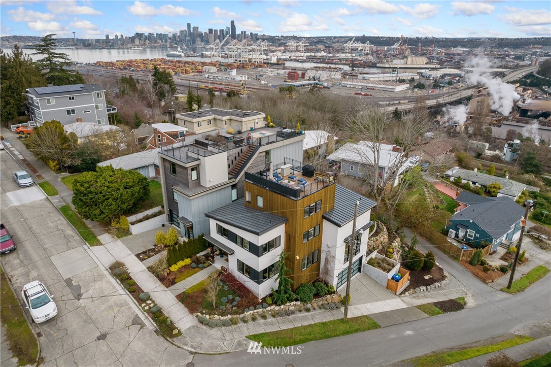 3740 34th Avenue Southwest Seattle, WA 98126 - Photo 1 of 31 an aerial view of a house with outdoor space and lake view in back
