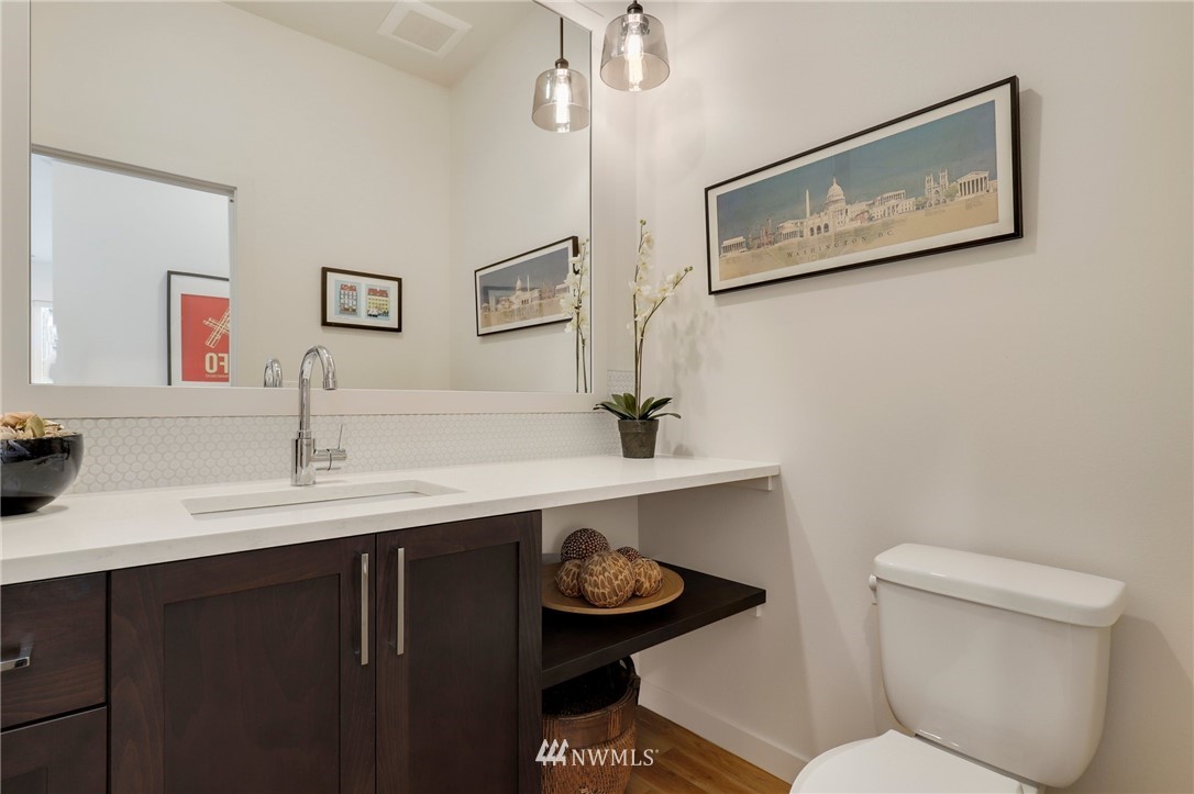 3740 34th Avenue Southwest Seattle, WA 98126 - Photo 15 of 31 a bathroom with a toilet a sink and mirror