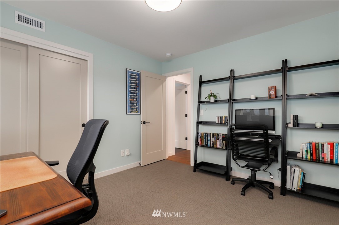 3740 34th Avenue Southwest Seattle, WA 98126 - Photo 22 of 31 a view of a workspace with furniture and closet