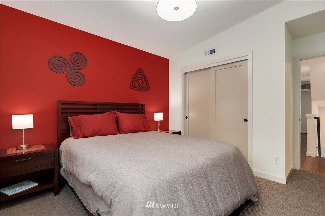 3740 34th Avenue Southwest Seattle, WA 98126 - Photo 23 of 31 a bedroom with a bed and a lamp