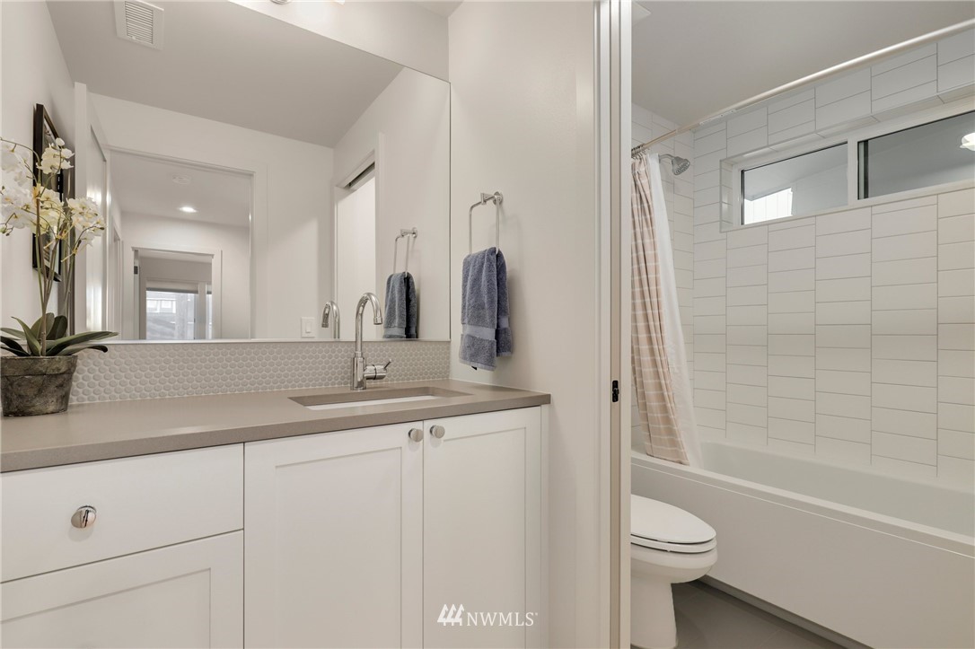 3740 34th Avenue Southwest Seattle, WA 98126 - Photo 24 of 31 a bathroom with a double vanity sink toilet and shower