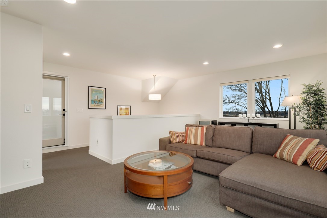 3740 34th Avenue Southwest Seattle, WA 98126 - Photo 25 of 31 a living room with furniture and a large window