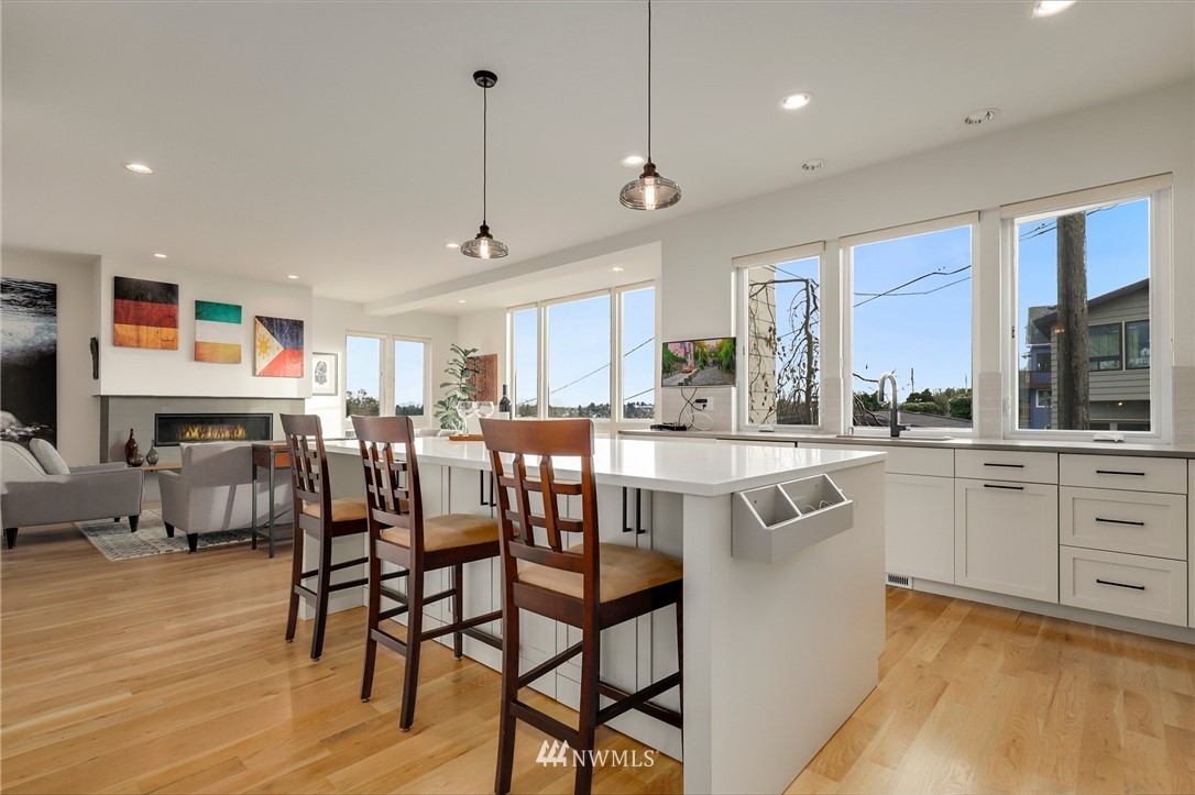 3740 34th Avenue Southwest Seattle, WA 98126 - Photo 7 of 31 a large kitchen with a table and chairs