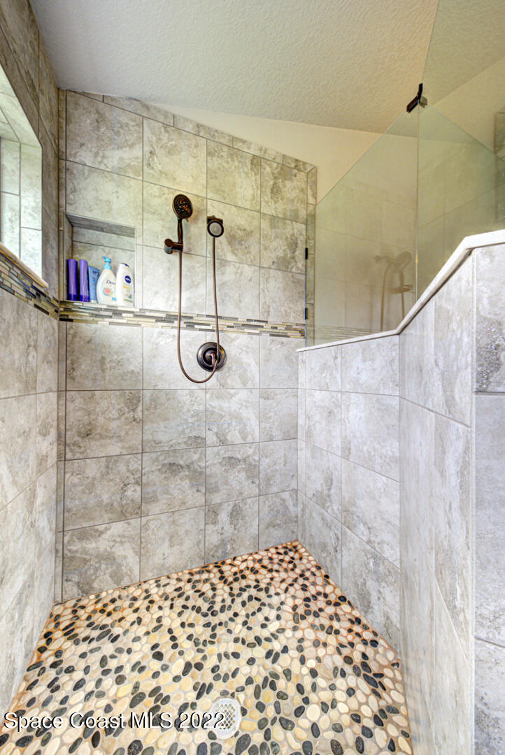3945 Post Road Melbourne, FL 32934 - Photo 11 of 24 a bathroom with a shower