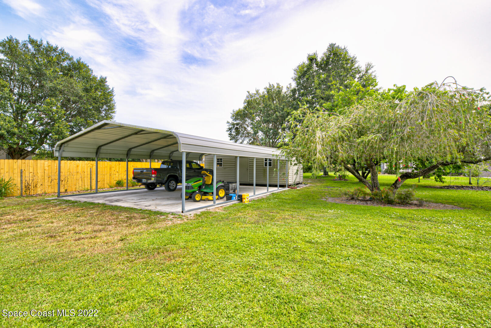 3945 Post Road Melbourne, FL 32934 - Photo 15 of 24 a view of a house with swimming pool and sitting area