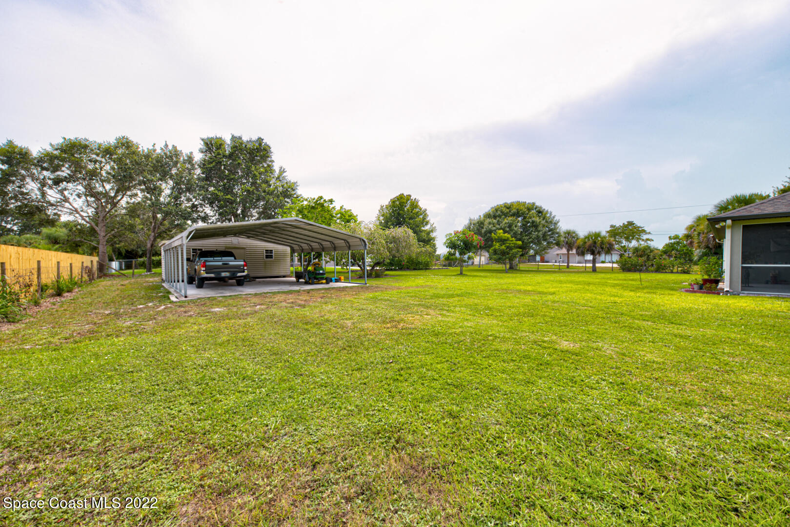 3945 Post Road Melbourne, FL 32934 - Photo 17 of 24 a car parked in the middle of a field