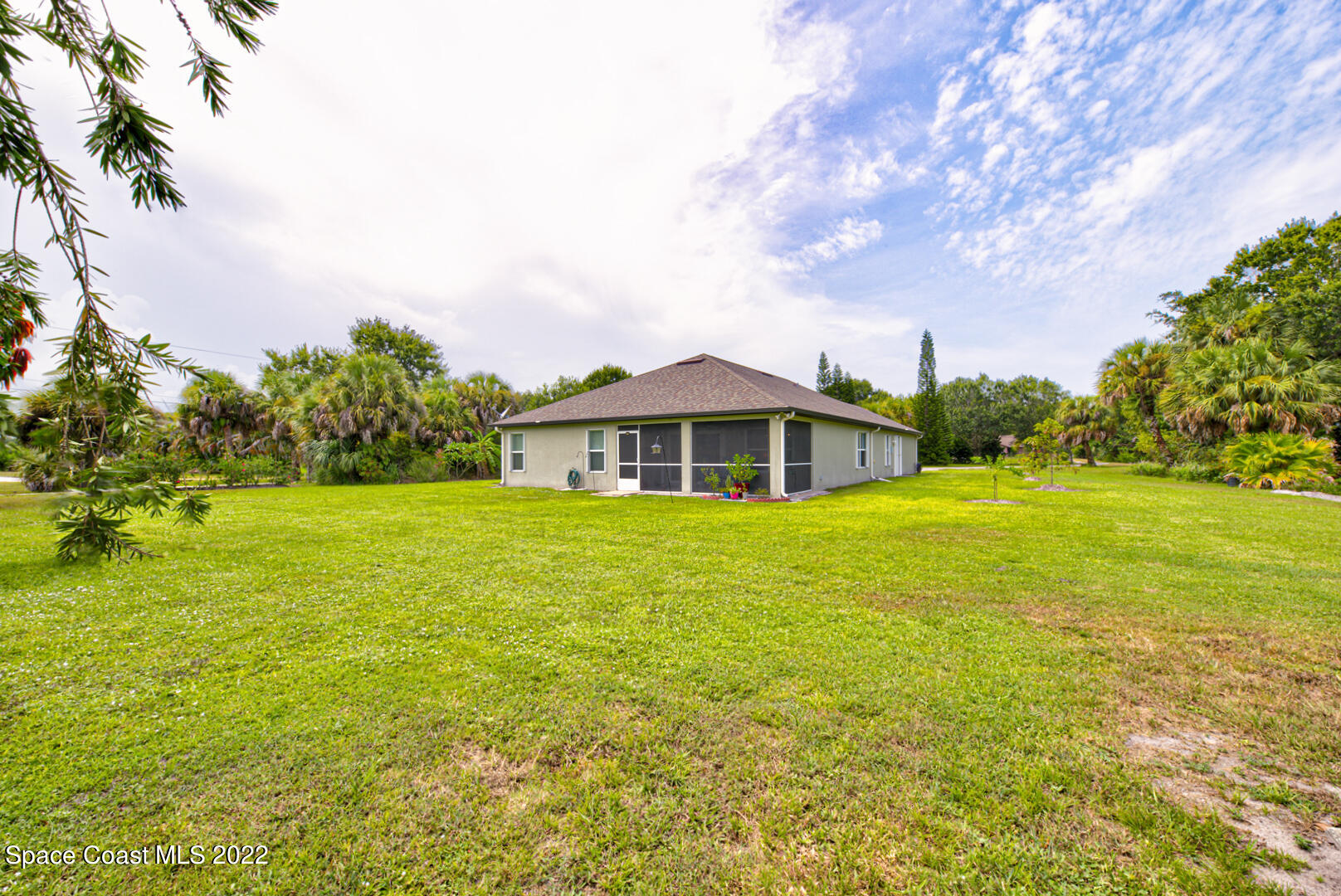 3945 Post Road Melbourne, FL 32934 - Photo 19 of 24 a front view of house with yard and green space