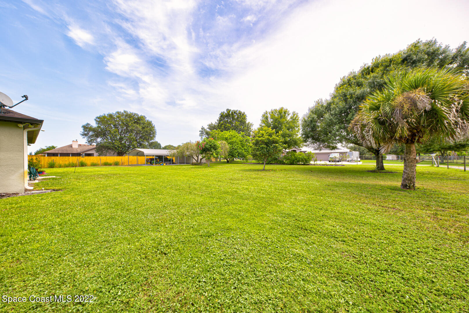 3945 Post Road Melbourne, FL 32934 - Photo 20 of 24 a view of yard with swimming pool and green space